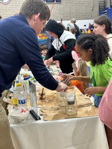 Children working on a science experiment.